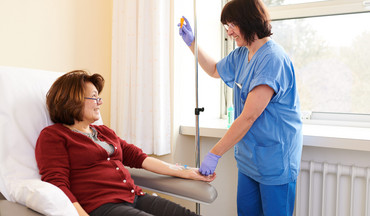 A nurse administers an infusion